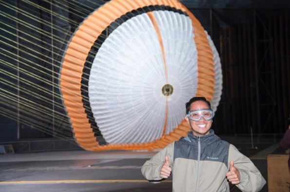Gregory Villar in front of a Mars parachute during a wind tunnel test